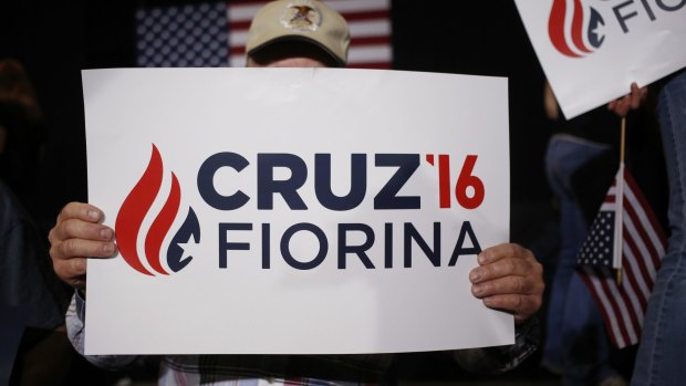 An attendee holds a sign during a campaign event for Senator Ted Cruz.