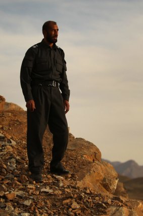 'I do things; they talk': Matiullah Khan on a mountain ridge in Oruzgan province in January 2013.
