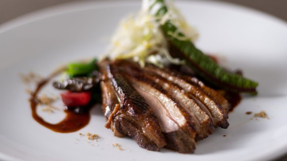 Hoji tea-smoked duck breast with pickled quandong and sansho peppercorn jus at Wa Kenbo, Fitzroy.