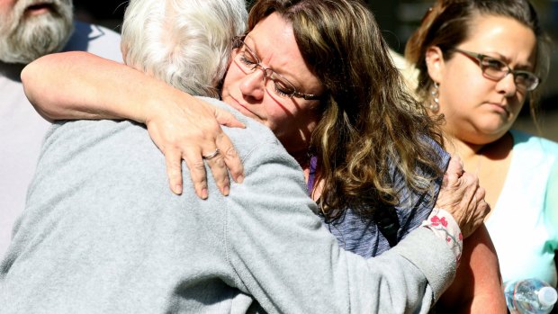 Friends and family are reunited with students after the shooting.