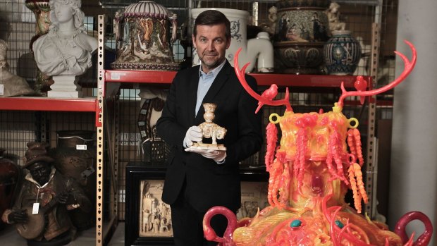 Basement collection: Powerhouse Museum curatorial director Peter Denham with a moulded porcelain elephant vase from England, 1882, and a vase by Kate Rohde, 2016.
