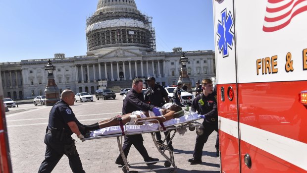 First responders transport the person believed to be the suspect in a shooting at the US Capitol complex on Monday.