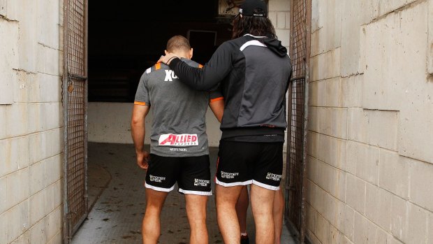 Brothers in arms: Aaron Woods and Robbie Farah during the hooker's difficult last season at the Tigers.