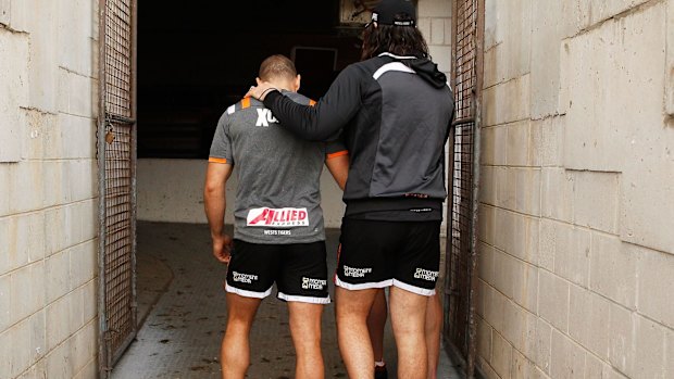 Brothers in arms: Aaron Woods and Robbie Farah during the hooker's difficult last season at the Tigers.