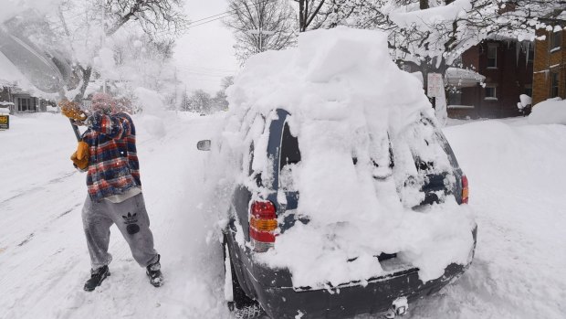 Kevin Deiner of Erie, Pensylvannia, digs out his car on Saturday. 