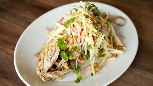 Whole fried snapper with apple salad.