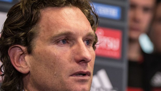 An emotional James Hird sheds a tear at a press conference to announce he is stepping down as coach of Essendon.