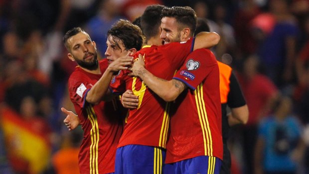One to avoid: Spanish players celebrate after beating Albania 3-0 in October.