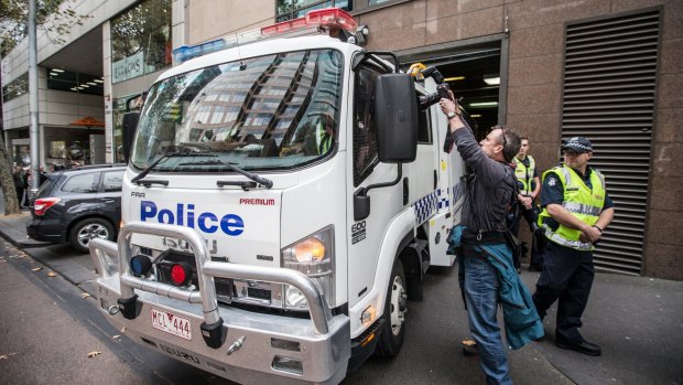 A police van carrying five alleged terror suspects arrives at the Melbourne Magistrates Court on Thursday