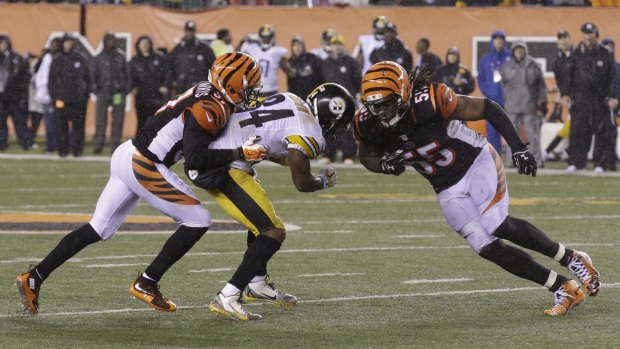 Dirty hit: Vontaze Burfict leads with the shoulder into the head of Antonio Brown. 