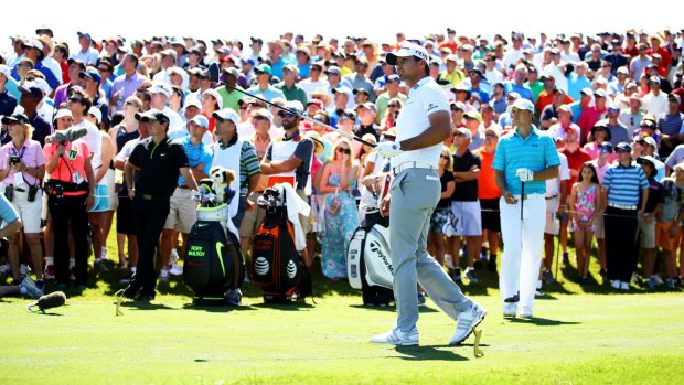 Australian Jason Day watches the flight of his shot from the 18th tee during round one of The Players Championship at TPC Sawgrass.