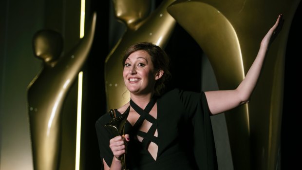 Celia Pacquola celebrates her AACTA Award win. 