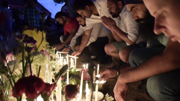 Friends and bus drivers gathered at a vigil in Moorooka, Brisbane on Saturday night to pay their respects to Manmeet Sharma.