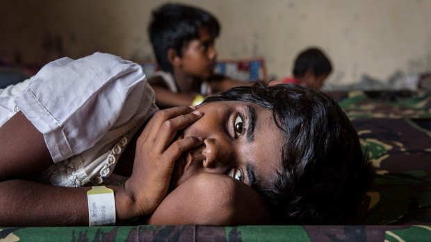 A Rohingya girl resting at a temporary refugee shelter in Aceh, Indonesia, in May.