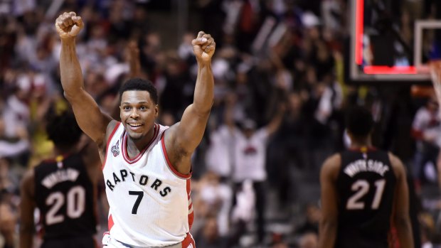 Prayer answered: Toronto Raptors guard Kyle Lowry reacts after making a buzzer beater three-point basket to tie the game against the Miami Heat in regulation time.
