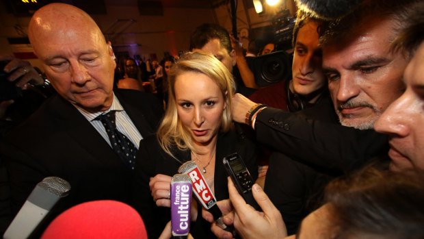 National Front regional leader Marion Marechal-Le Pen speaks to reporters after elections in France.