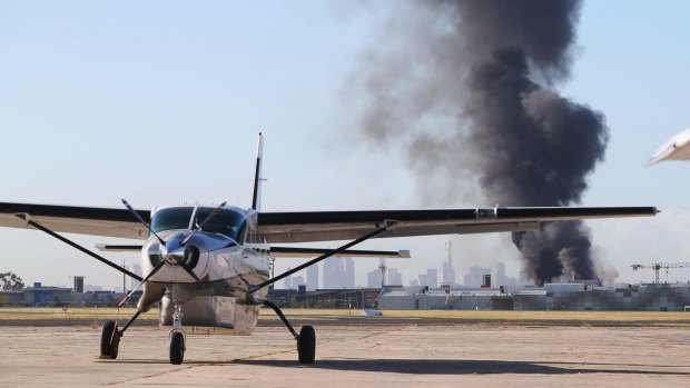 A plume of smoke from the crash at Essendon Airport on Tuesday. 