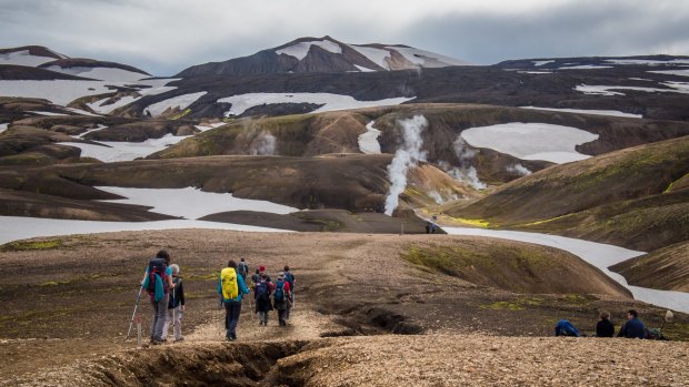 We walk among the ghostly bodies of sulphuric steam levitating above the lava field.