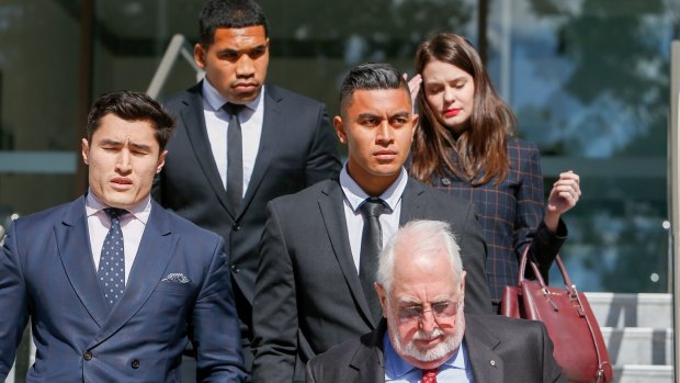 Siliva Havili (second from left) and Tim Lafai (centre) leaving a Wollongong court with their legal team.