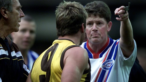 Shane Crawford, then-Hawthorn captain is ordered from the ground by umpire Brett Allen under the blood rule. 