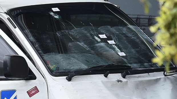 Bullet holes seen in the van on Carrick Drive.