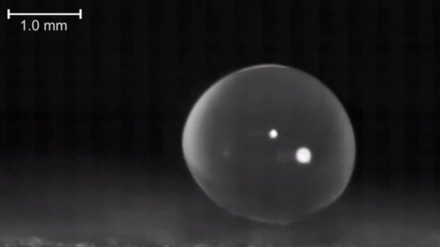 A tiny water droplet levitates off a hydrophobic surface as it freezes. Understanding the phenomenon could lead to materials that de-ice themselves.