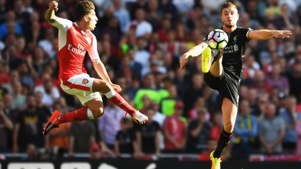 Liverpool's Jordan Henderson is closed down by Arsenal's Hector Bellerin at Emirates Stadium on Sunday.