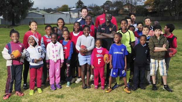 Inspiration: Swans player Aliir Aliir charms the mostly Burmese, Afghan and African youngsters at the multicultural camp in Wagga Wagga.