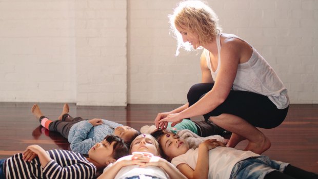 Radha Babicci teaches children mindfulness and yoga at a Sydney long day-care centre. 