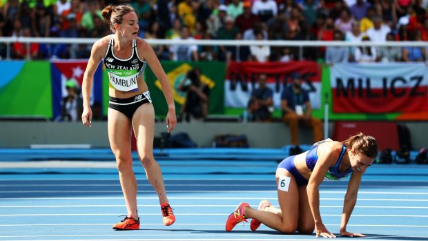 Nikki Hamblin, left, looks back after she clipped heels with Abbey D'Agostino.