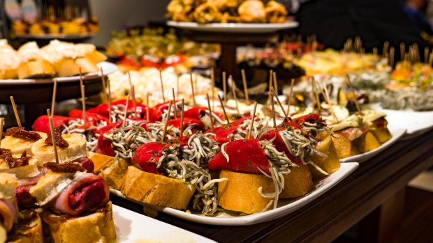 Pintxos on display on the counter of a bar in the Basque region of Spain.