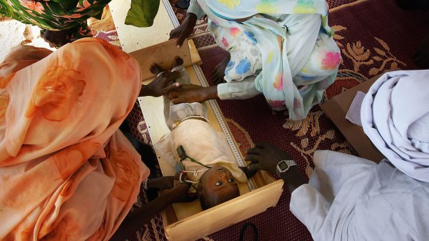 An infant refugee from the Darfur region of Sudan is treated at the Oure Cassini refugee camp in north-eastern Chad. Tens of thousands of refugees have fled to Chad this year to escape wars and terrorism in neighbouring countries.