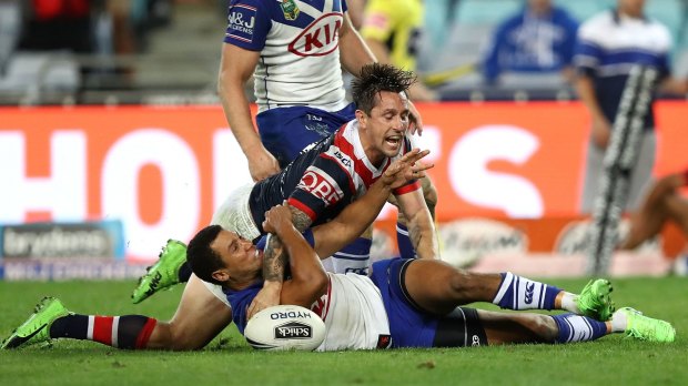 Mitchell Pearce of the Roosters scores the winning try during the round 11 NRL match between the Canterbury Bulldogs and the Sydney Roosters at ANZ Stadium on Sunday.