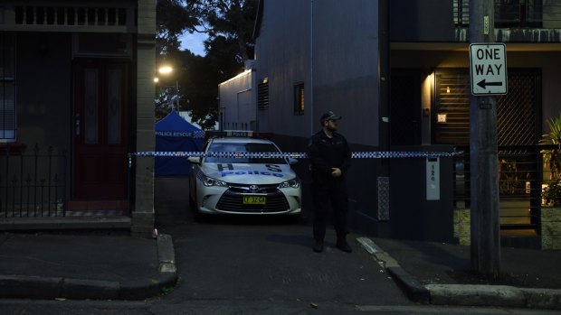 Police at one of the raided premises in Surry Hills. 