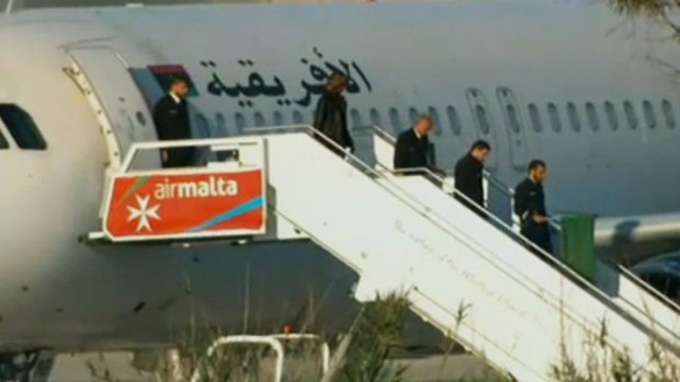 Passengers are freed from the hijacked Afriqiyah Airways plane.