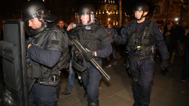 Police and the military were out in force in Paris after Friday night's attack, and Western governments must decide whether terrorists should continue to be treated as criminals, or if they warrant a military response.