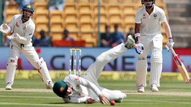 Close call: Lokesh Rahul watches Peter Handscomb drop the ball early in the day.