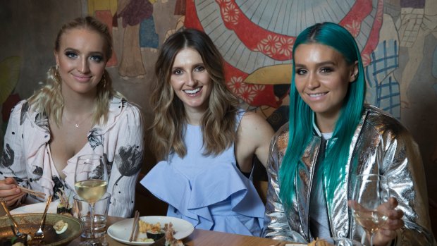 "It was a whirlwind’’: Emma (left) and Amy Sheppard (right) with Kate Waterhouse at Tokonoma.