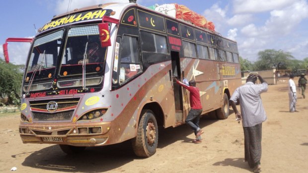 Brutal attack: Rescue workers check a bus that was ambushed about 50 kilometres from the town of Mandera near Kenya's border with Somalia. 