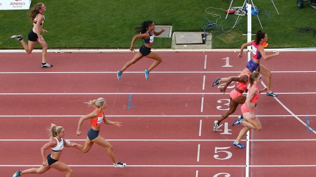 Photo finish:  Ella Nelson of NSW, Toea Wisil of PNG and Melissa Breen of ACT cross the finish line in the 100 metres.