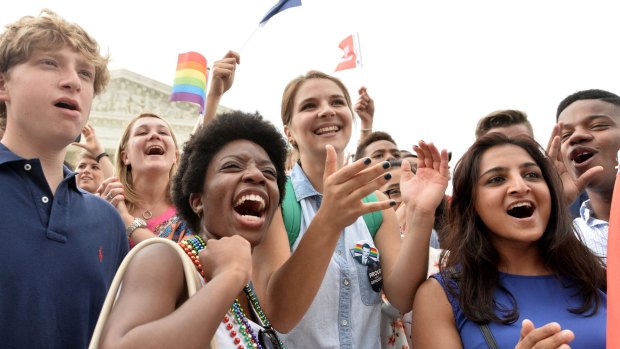 People shout slogans as they celebrate outside the Supreme Court in Washington, DC after its historic decision on gay marriage. 