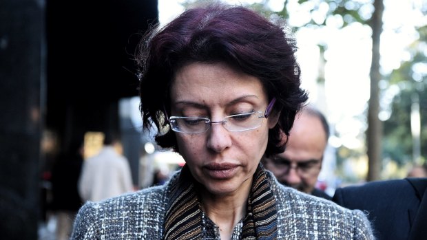 Eman Sharobeem leaves an ICAC hearing where she was accused of fraud over nearly a decade. 