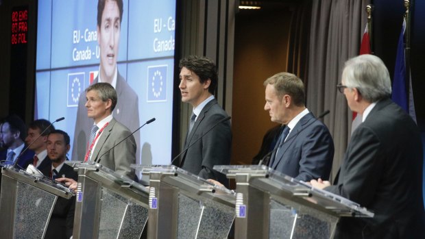 Mr Trudeau speaks during a media conference after the signing.