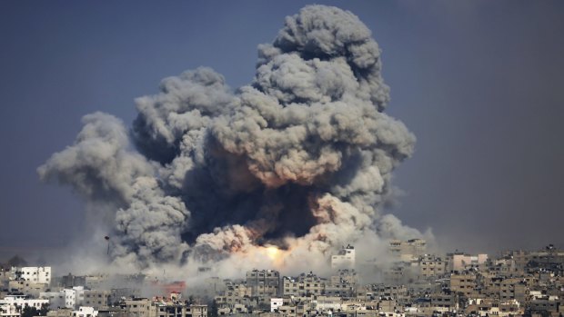 Smoke and fire rise from the explosion of an Israeli strike rise over Gaza City during the 50-day Gaza war in July 2014. 