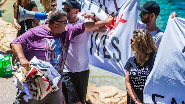 A member of the audience clashes with the protesters.