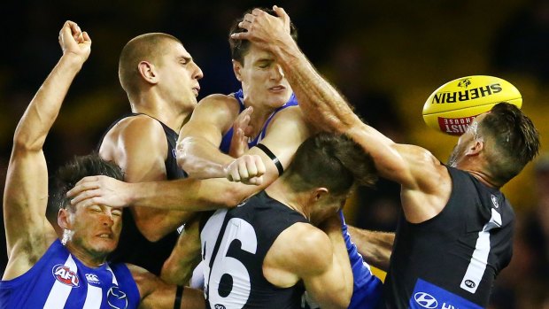 North and Blues players come together in a marking contest.