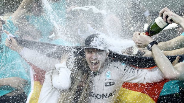 Nico Rosberg celebrates winning the Formula One World Championship for Mercedes. 