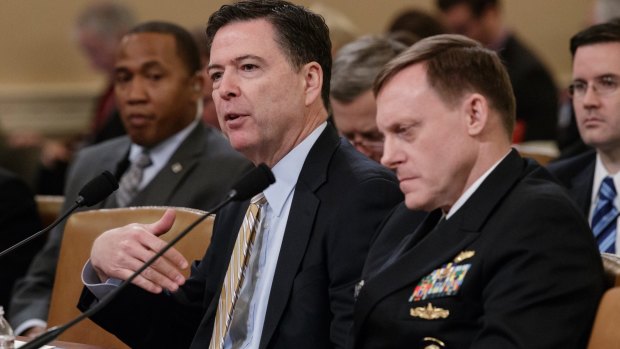 FBI Director James Comey, left, and National Security Agency Director Michael Rogers testify on Capitol Hill.