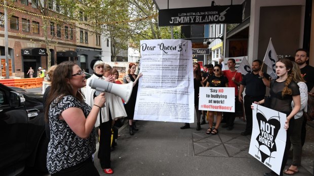 Claire Boland (with megaphone) from the Young Workers Centre, with former staff and supporters at the protest, the culmination of a "break up with Honey Birdette" boycott campaign that has attracted over 1000 signatures in a week.