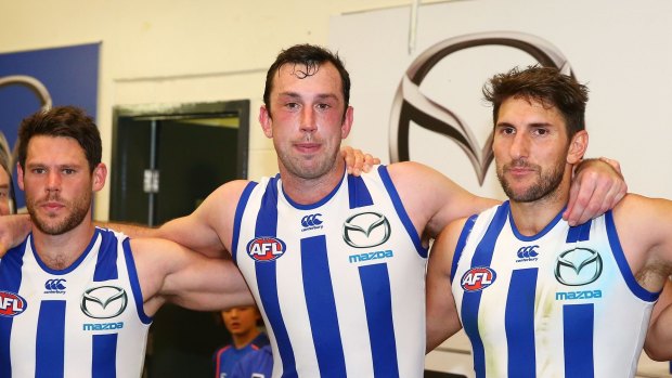 Kangaroos sing the team song after beating Essendon. Happy aren't they?